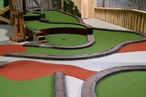 indoor commercial synthetic putting greens installation by Unreal Lawns