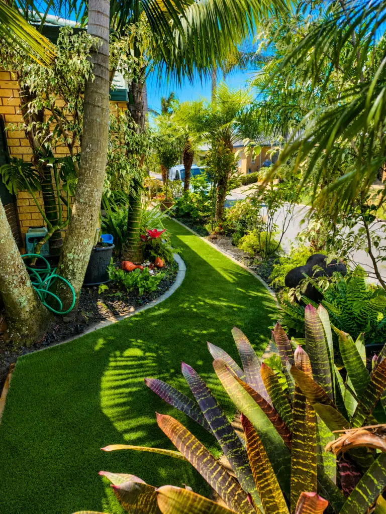 Tropical garden path in the sun Jul 21, 2026, 08_15_47 AM Artificial Grass Auckland